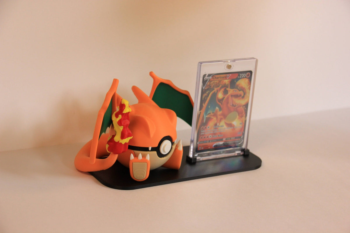 Charizard Card Display from the side: the Pokéball's tail and wings, the One-Touch case behind. Card not included.