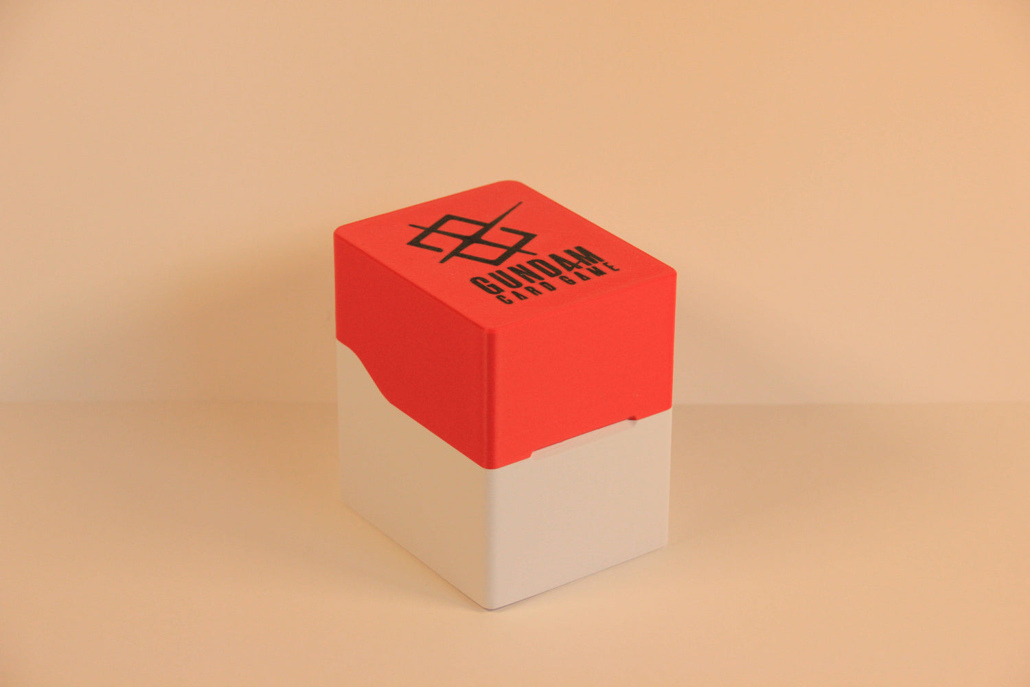 standard_gundam|Red and white Gundam Card Game Standard deck box closed, with the Gundam Card Game logo on the lid