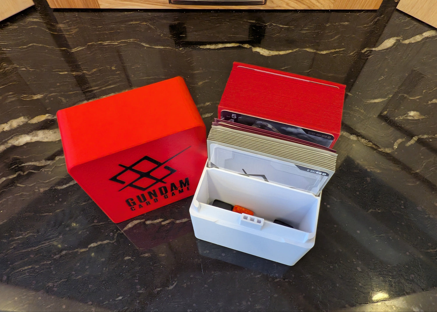 standard_gundam|Gundam Card Game Standard deck box open with sleeved deck, resource cards, and the dice and token well in front