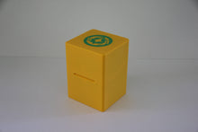 standard_lorcana|Yellow Disney Lorcana Standard deck box closed, with the green lore emblem on the lid