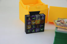 standard_lorcana|Close-up of the Disney Lorcana lore counter dice tray holding sixteen dice, deck box behind