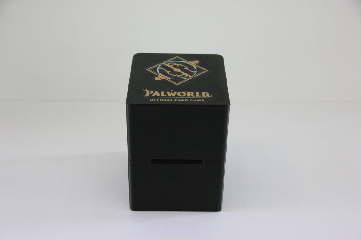 standard_palworld|Black Palworld deck box closed, front on, showing the logo lid and front card slot
