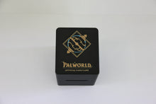 standard_palworld|Close-up of the gold and blue Palworld Official Card Game emblem on the deck box lid