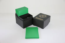 standard_palworld|Palworld deck box loaded with a sleeved deck and spare green sleeves in front of the logo lid