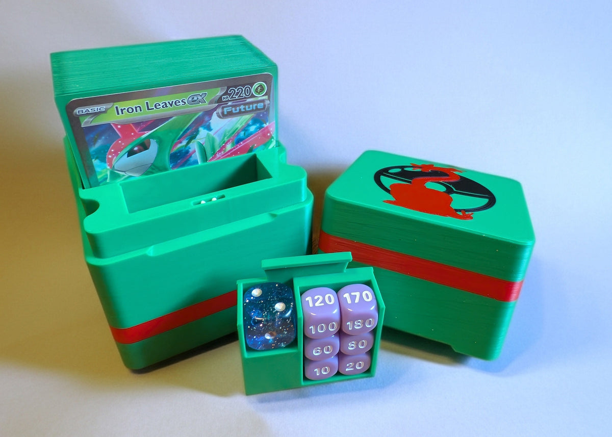 standard_pokemon|Green and red Pokémon Standard deck box with an Iron Leaves ex deck, Charizard pokéball lid graphic, and a damage-counter dice tray