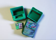standard_pokemon|Green and red Pokémon Standard deck box opened into its compartments with a dice tray and Iron Leaves ex card