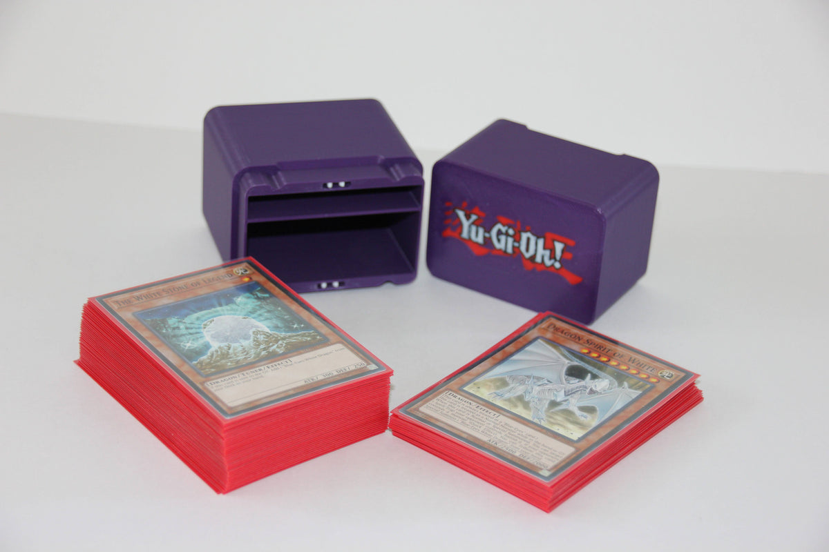 standard_yugioh|Purple Yu-Gi-Oh deck box lid and base separated showing the logo and card slot